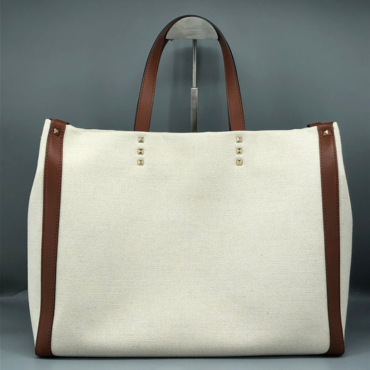 Valentino Garavani VLTN Grande Plage tote features canvas Cream/Caramel