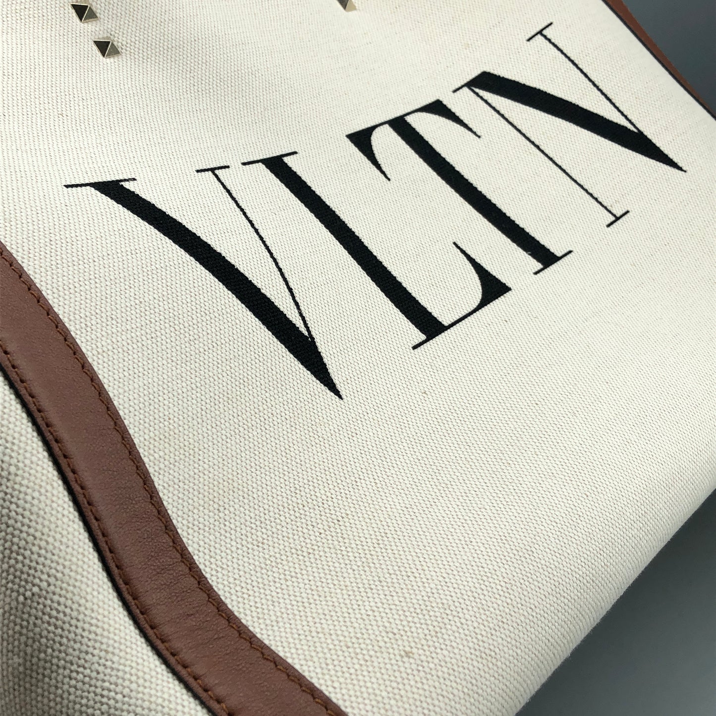 Valentino Garavani VLTN Grande Plage tote features canvas Cream/Caramel