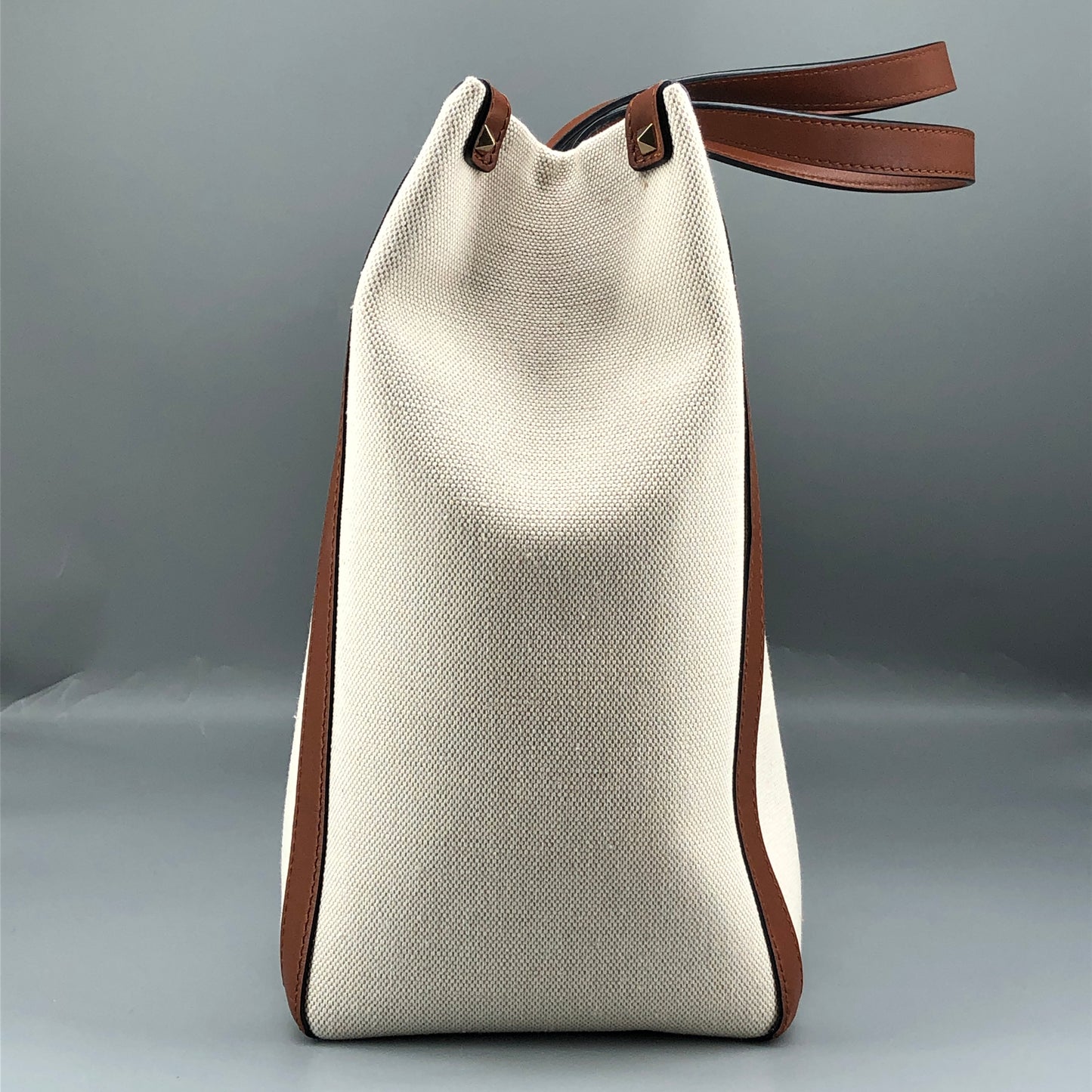 Valentino Garavani VLTN Grande Plage tote features canvas Cream/Caramel