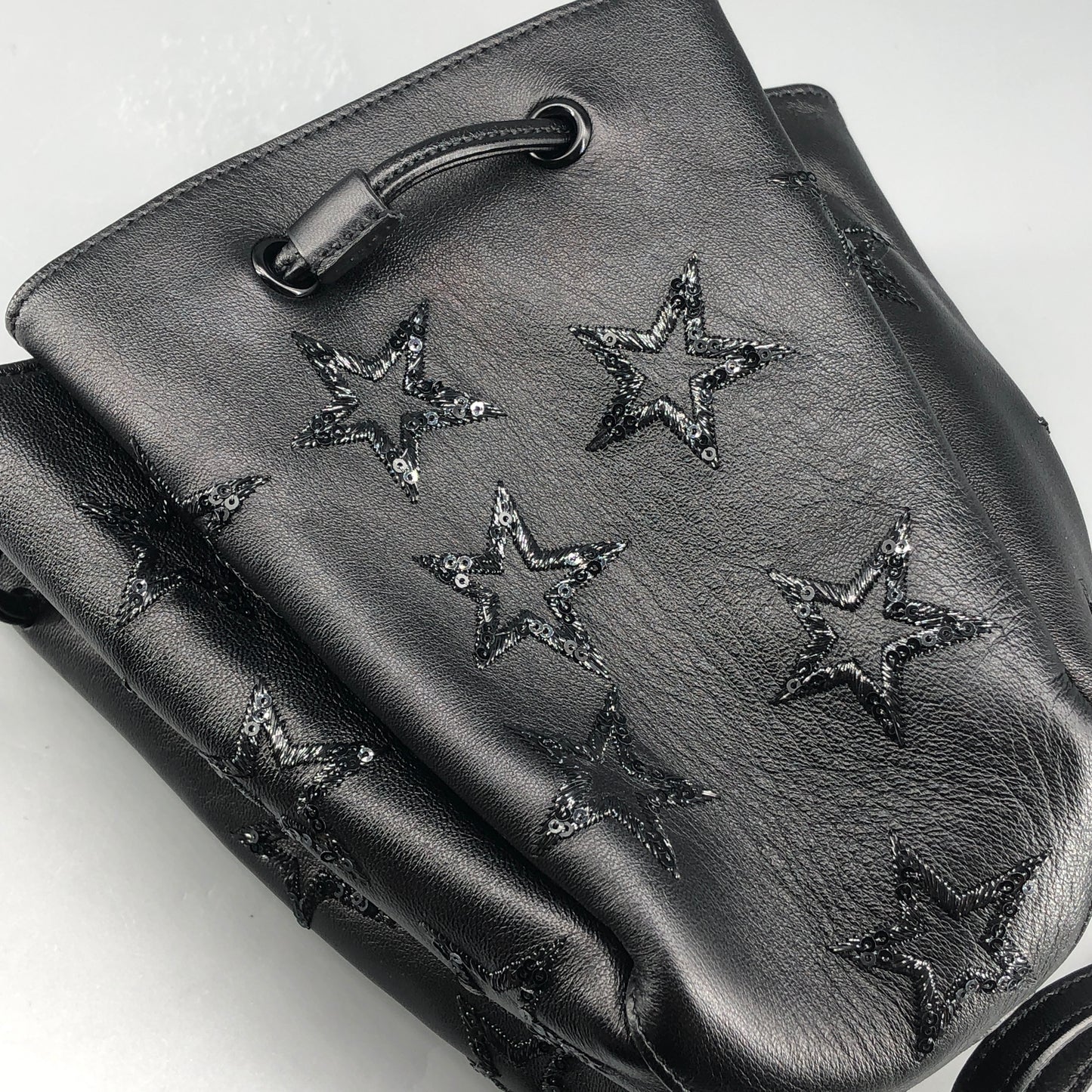 Saint Laurent Star Embossed Leather Mini Drawstring Bucket Bag Black