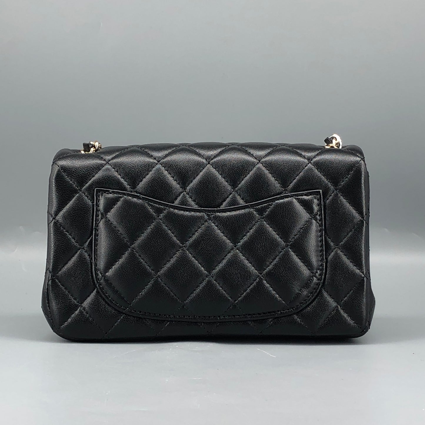 Chanel lambskin quilted mini rectangular flap bag in black with CC logo chain