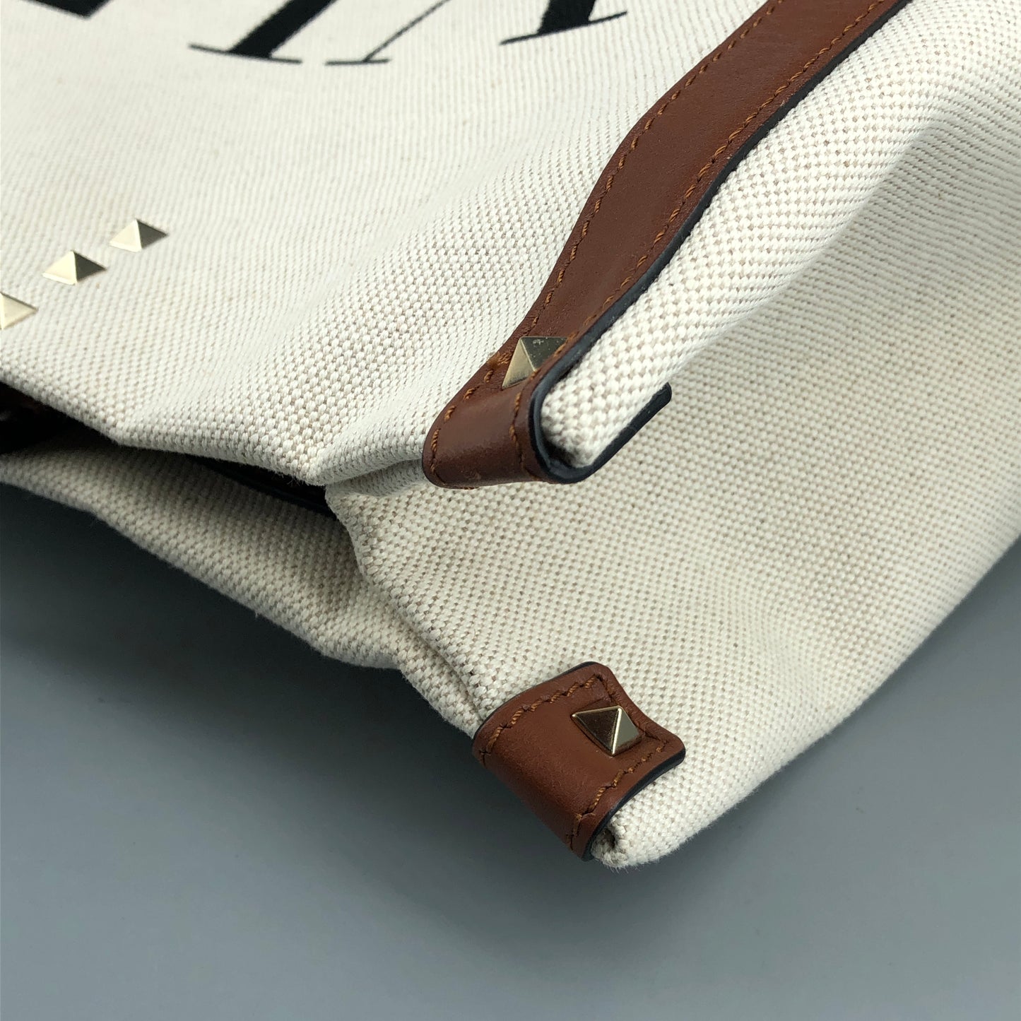 Valentino Garavani VLTN Grande Plage tote features canvas Cream/Caramel
