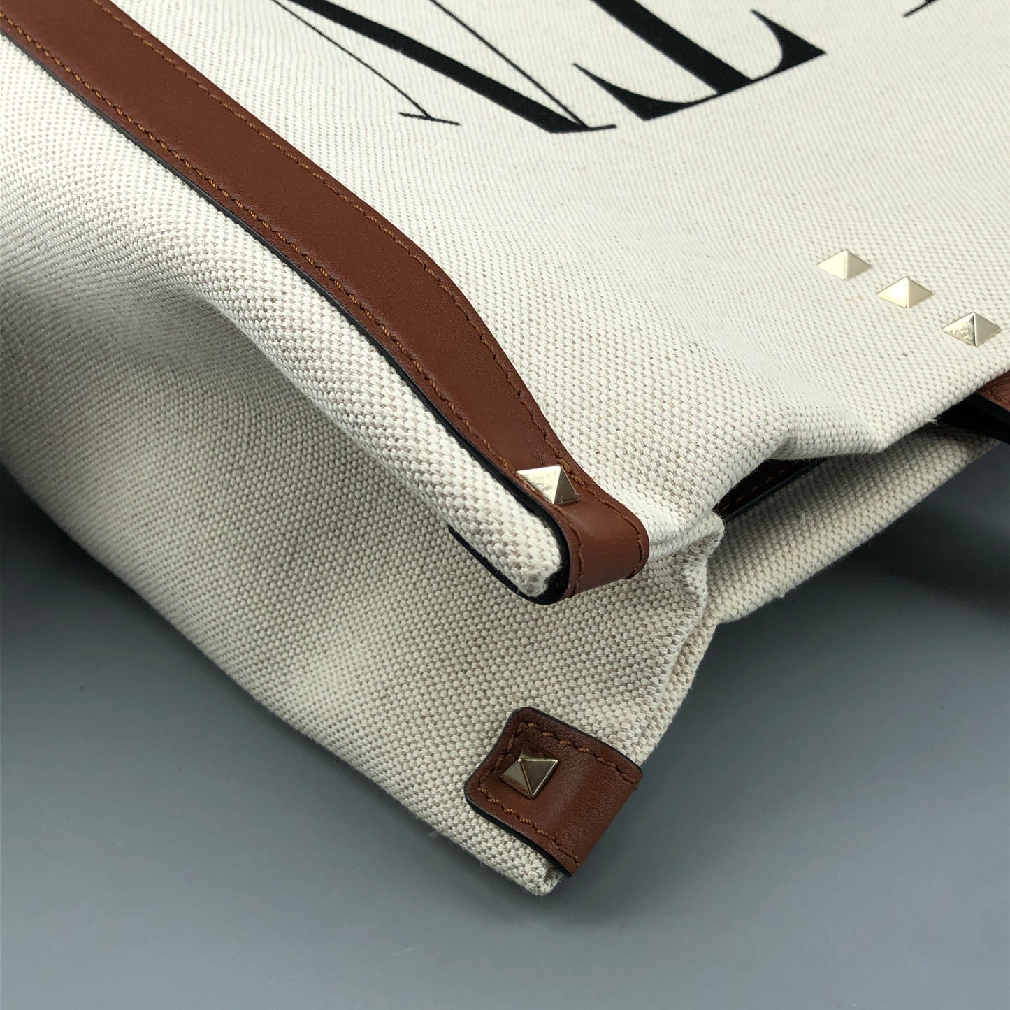 Valentino Garavani VLTN Grande Plage tote features canvas Cream/Caramel