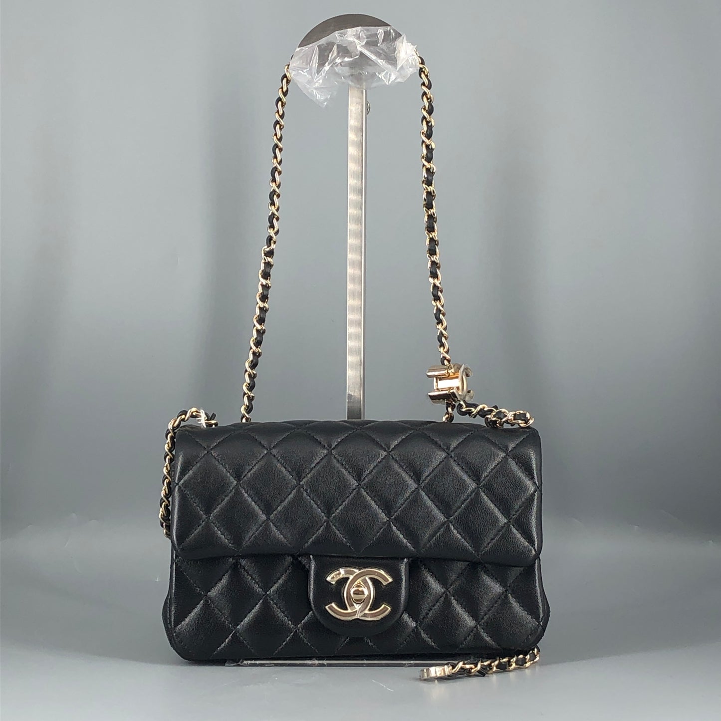Chanel lambskin quilted mini rectangular flap bag in black with CC logo chain