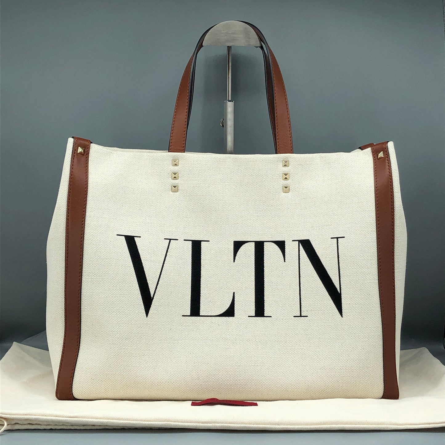 Valentino Garavani VLTN Grande Plage tote features canvas Cream/Caramel
