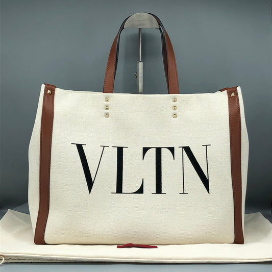 Valentino Garavani VLTN Grande Plage tote features canvas Cream/Caramel