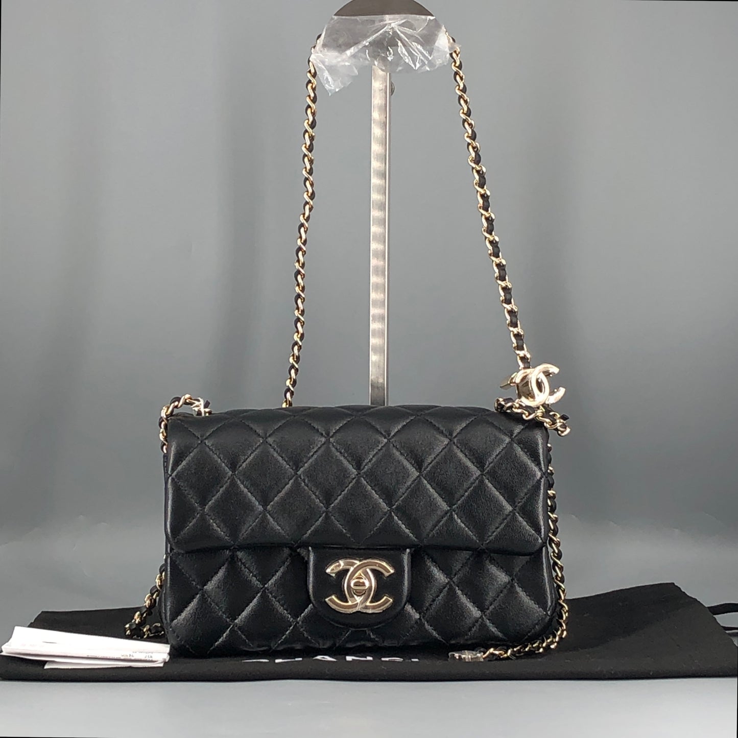 Chanel lambskin quilted mini rectangular flap bag in black with CC logo chain