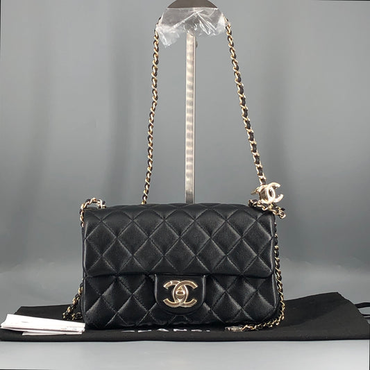 Chanel lambskin quilted mini rectangular flap bag in black with CC logo chain