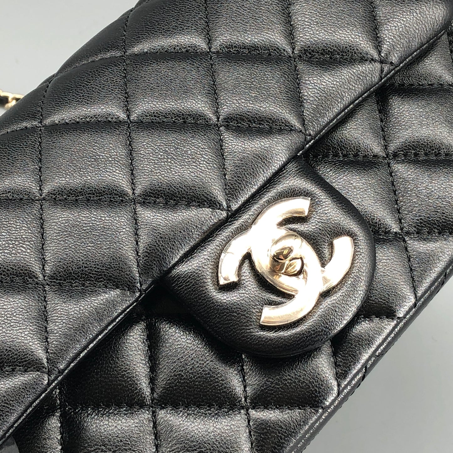 Chanel lambskin quilted mini rectangular flap bag in black with CC logo chain