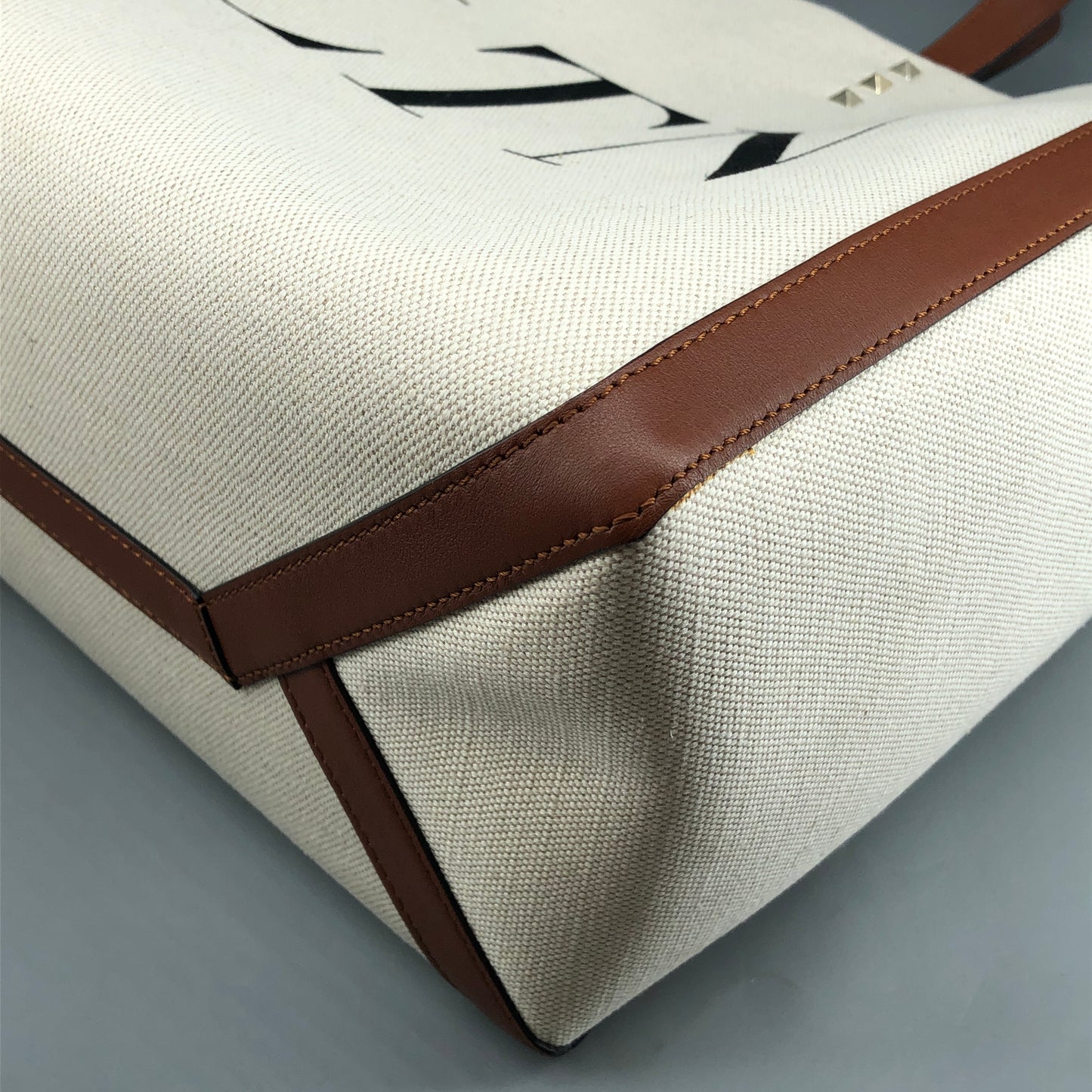 Valentino Garavani VLTN Grande Plage tote features canvas Cream/Caramel