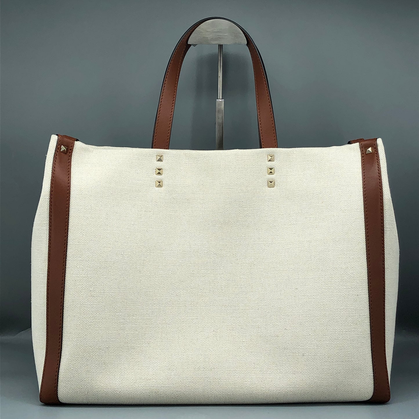 Valentino Garavani VLTN Grande Plage tote features canvas Cream/Caramel
