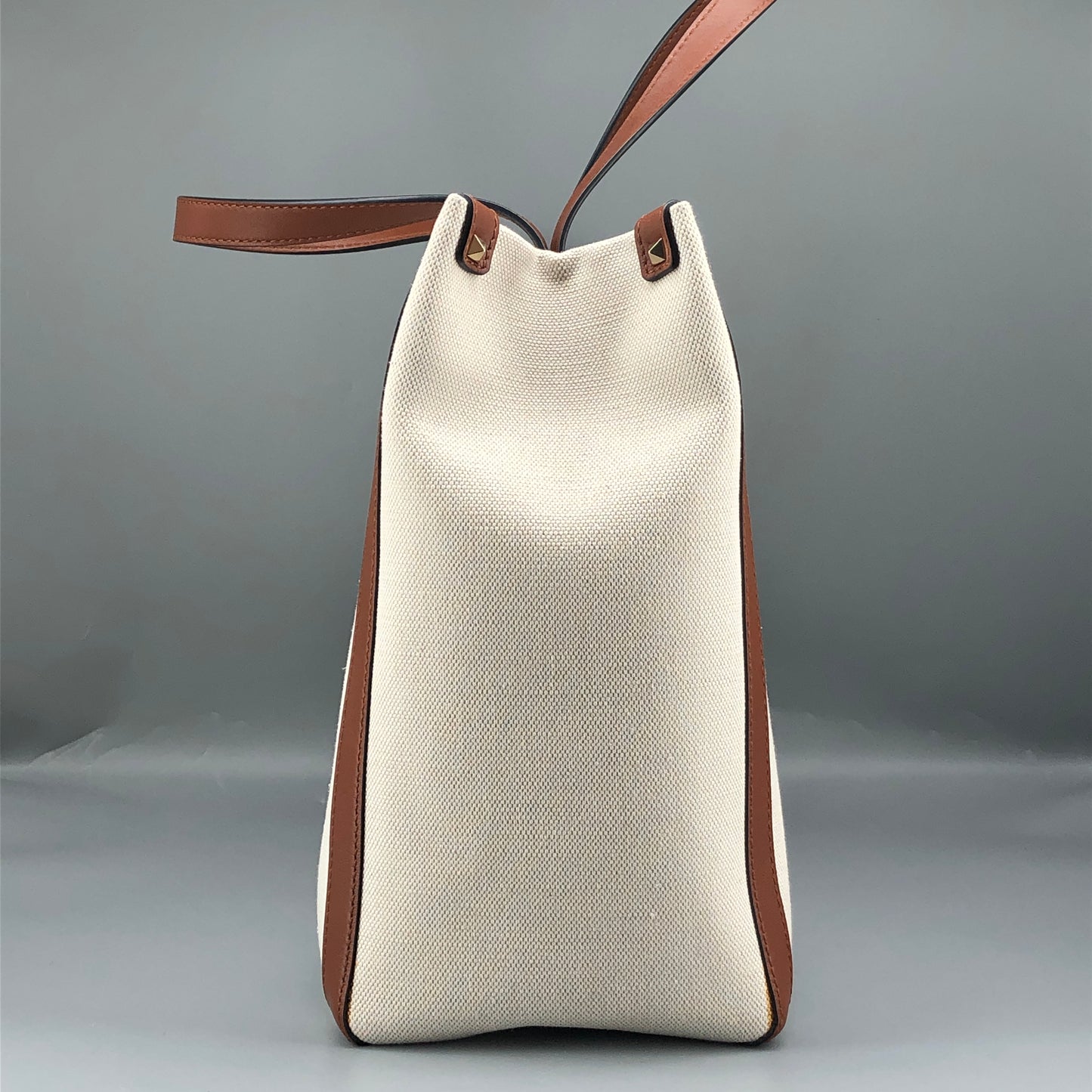 Valentino Garavani VLTN Grande Plage tote features canvas Cream/Caramel