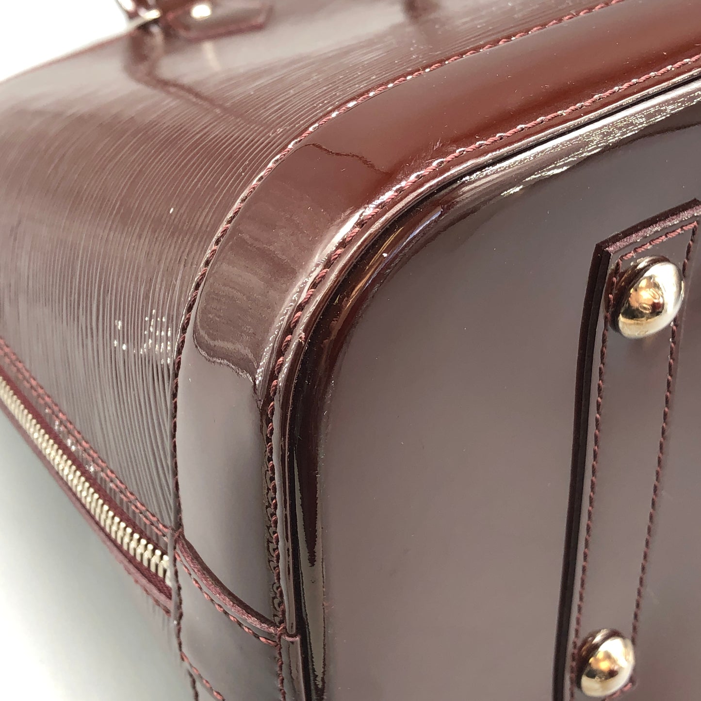 Louis Vuitton Alma Epi Electric Burgundy Brown Handbag